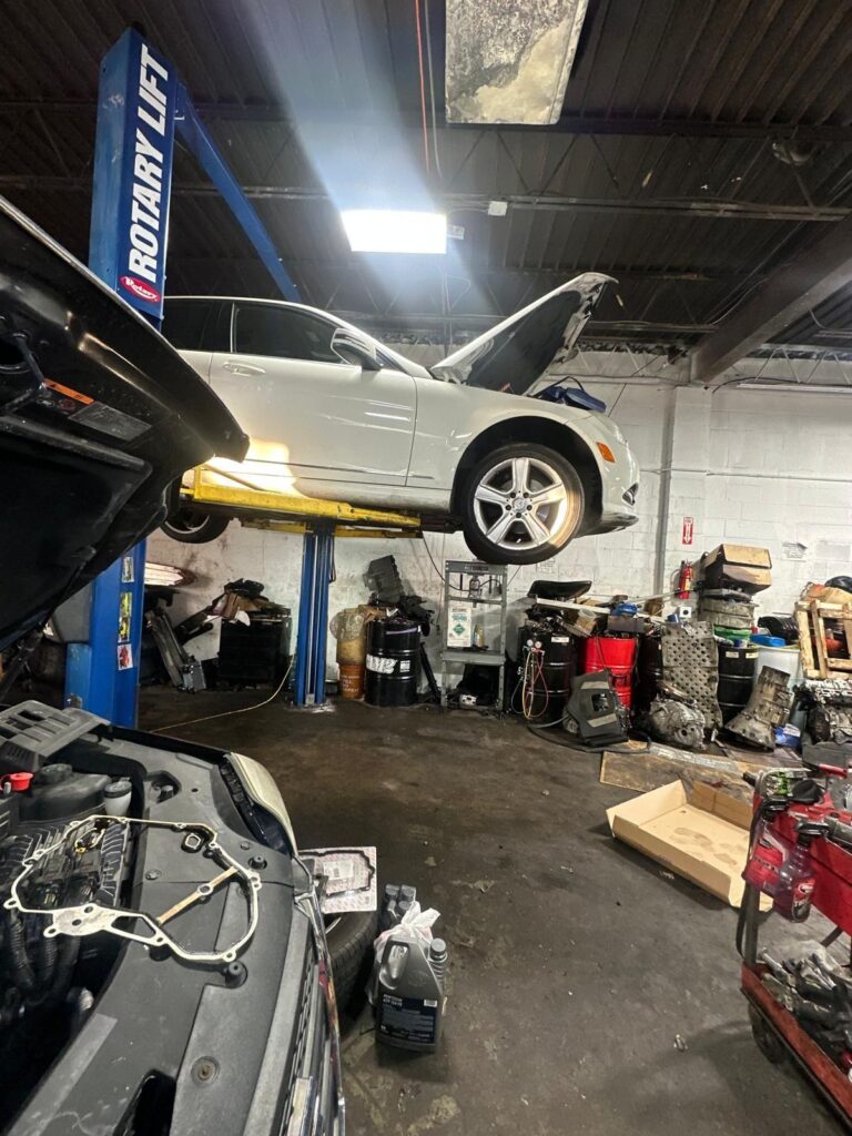 Workshop bay with a car on a lift