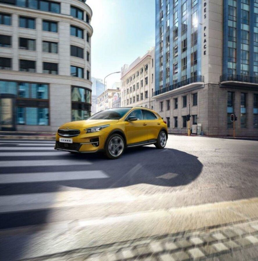 Yellow compact SUV on a city street